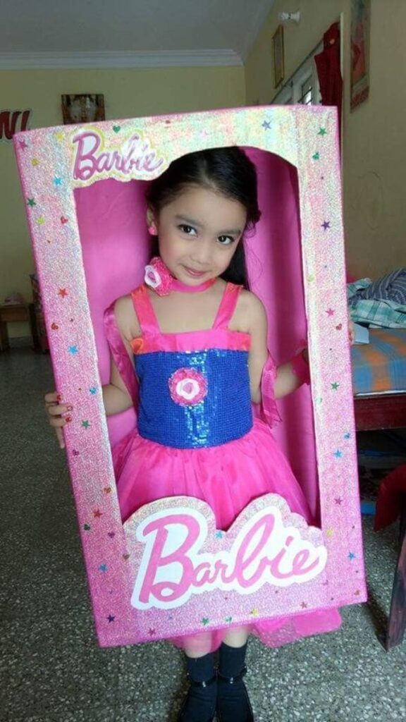 girl wearing barbie dress