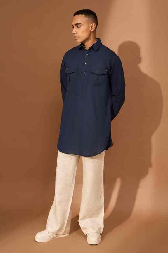 man wearing navy blue kurta with beige pajama