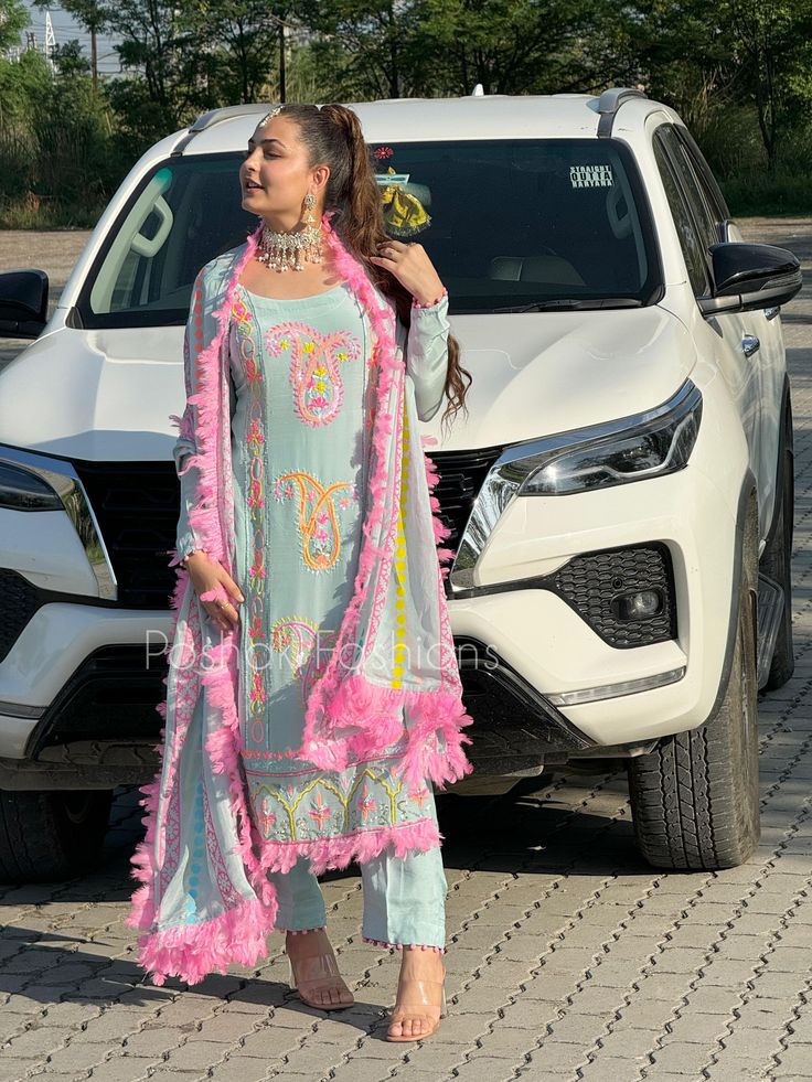 woman wearing Sky Blue & Baby Pink color suit