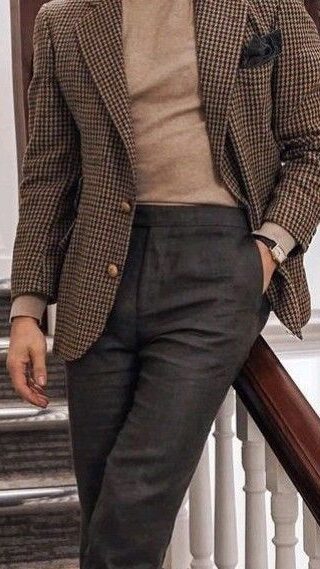 man wearing beige turtleneck with brown patterened blazer